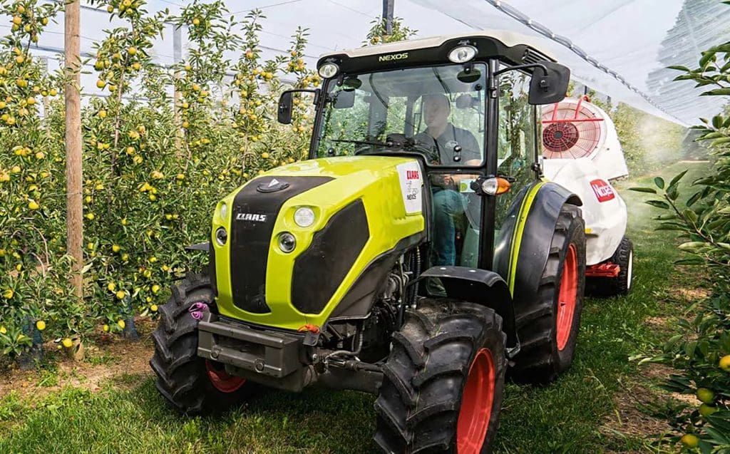 Claas NEXOS tractor in orchard