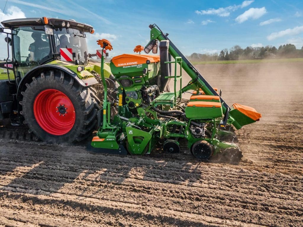 amazone precea seed drill getting pulled by claas tractor