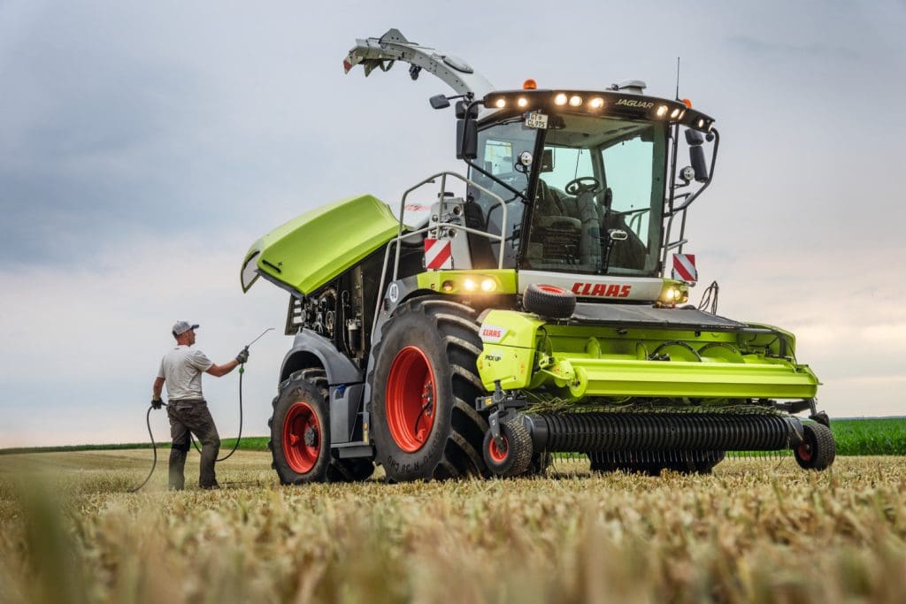 CLAAS Jag getting cleaned in field