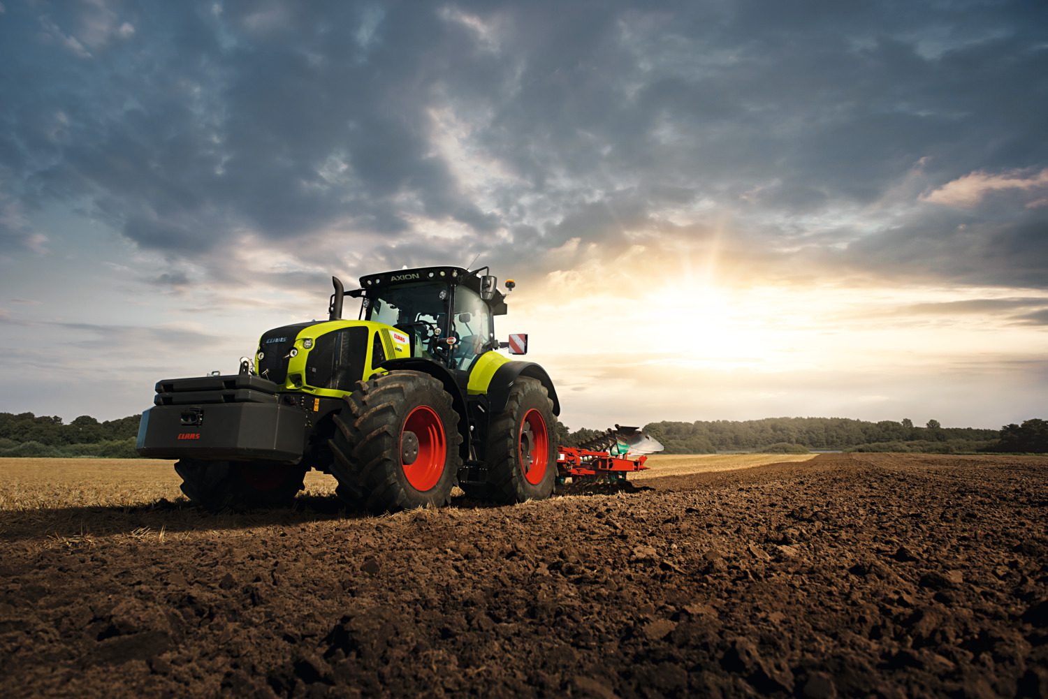 image of claas axion tractor cultivating a paddock