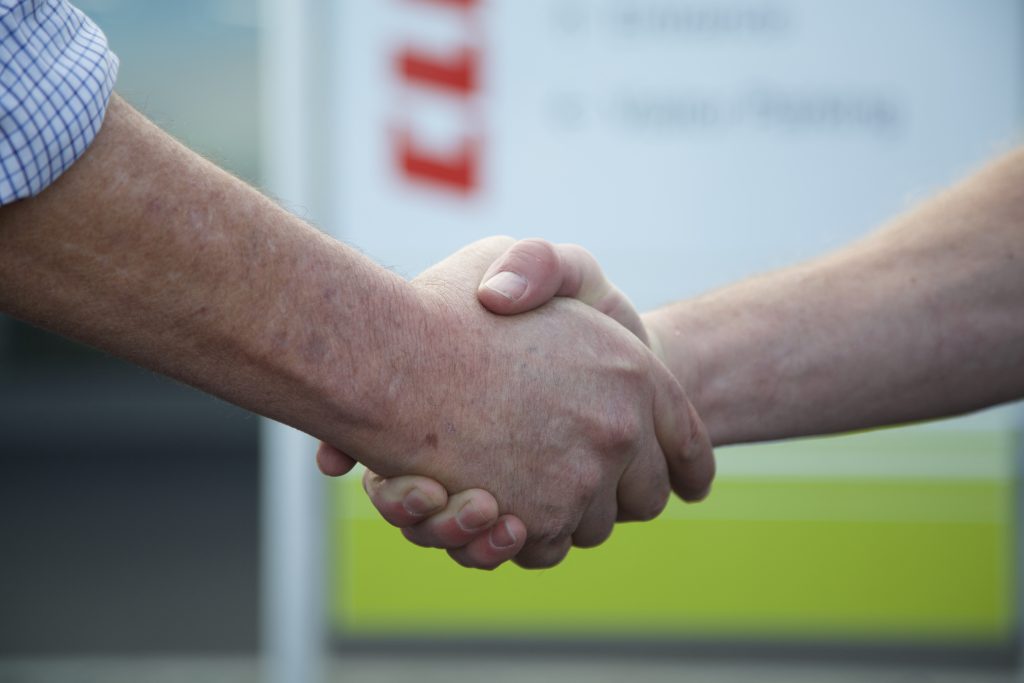 close up image of a handshake going on